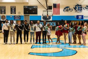 the entire court poses for photos