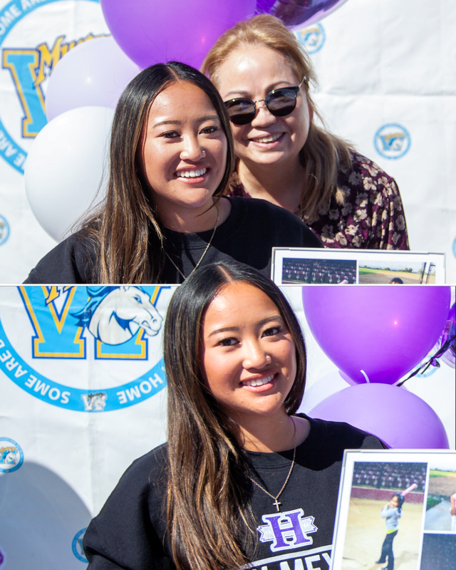 Woman poses happily with a picture frame featuring sports photos and balloons behind her.