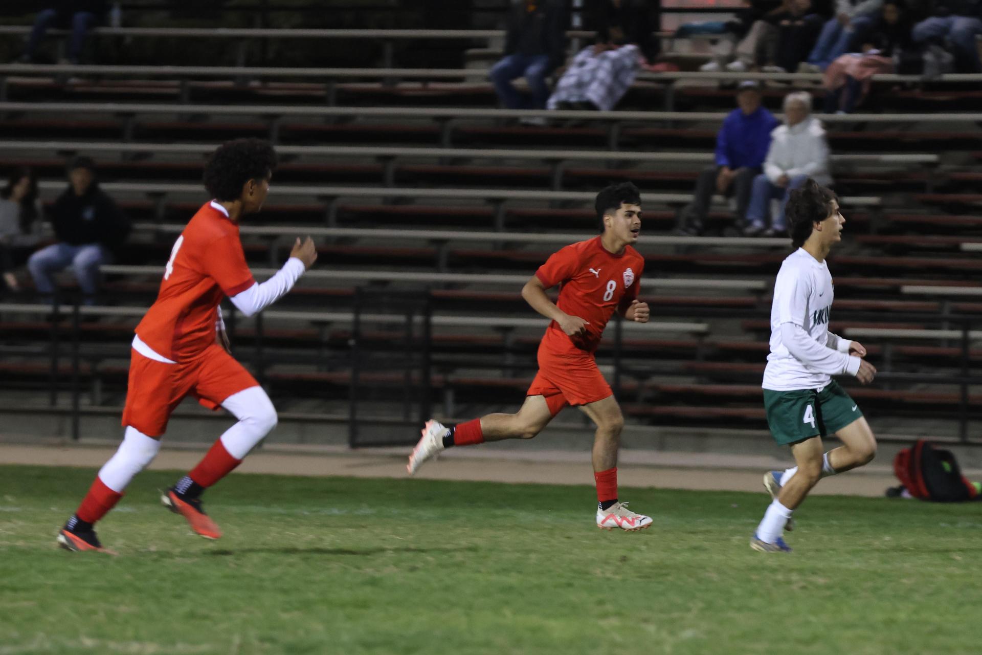 Varsity boys play soccer against Kingsburg