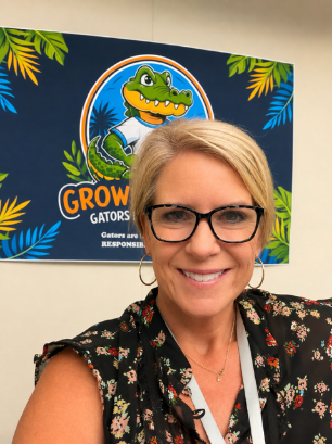 Dr. Pavidis with Gator banner