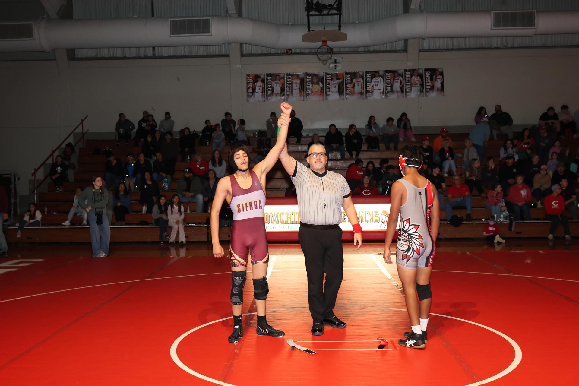 Wrestling winners with hands up 32