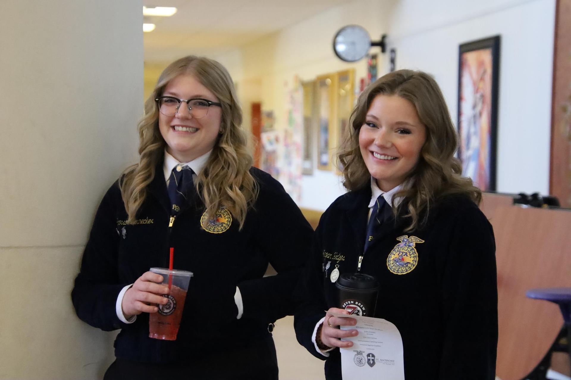two high school FFA students smiling for the camera