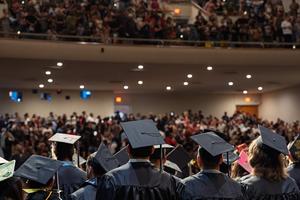 Graduates look out into the crowd