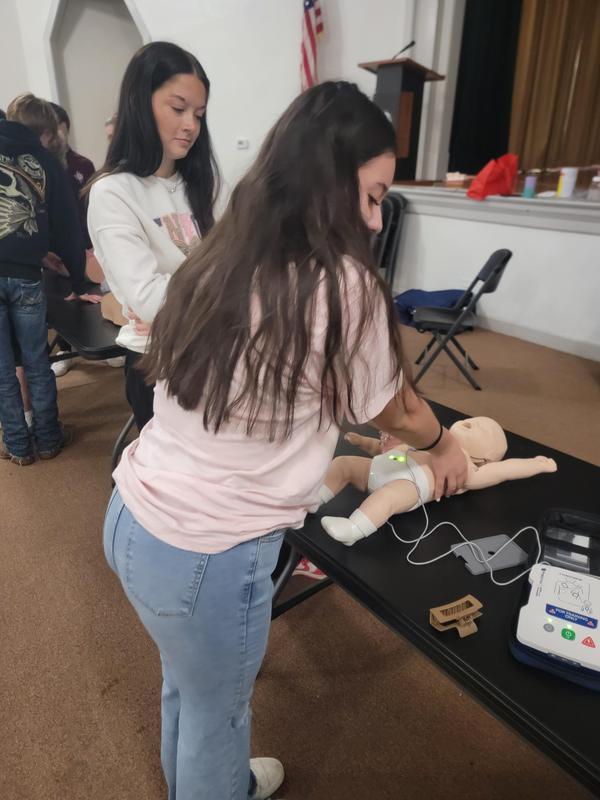 Senior students learning CPR.