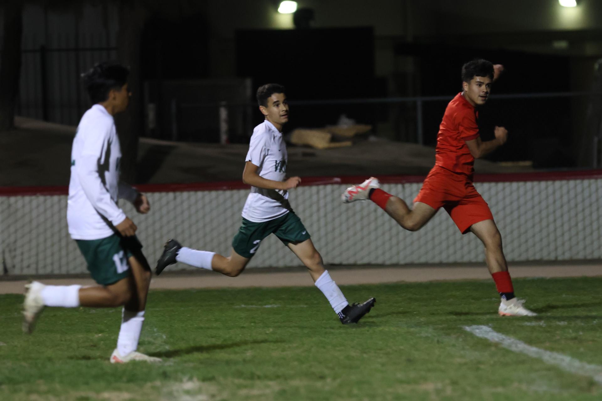 Varsity boys play soccer against Kingsburg