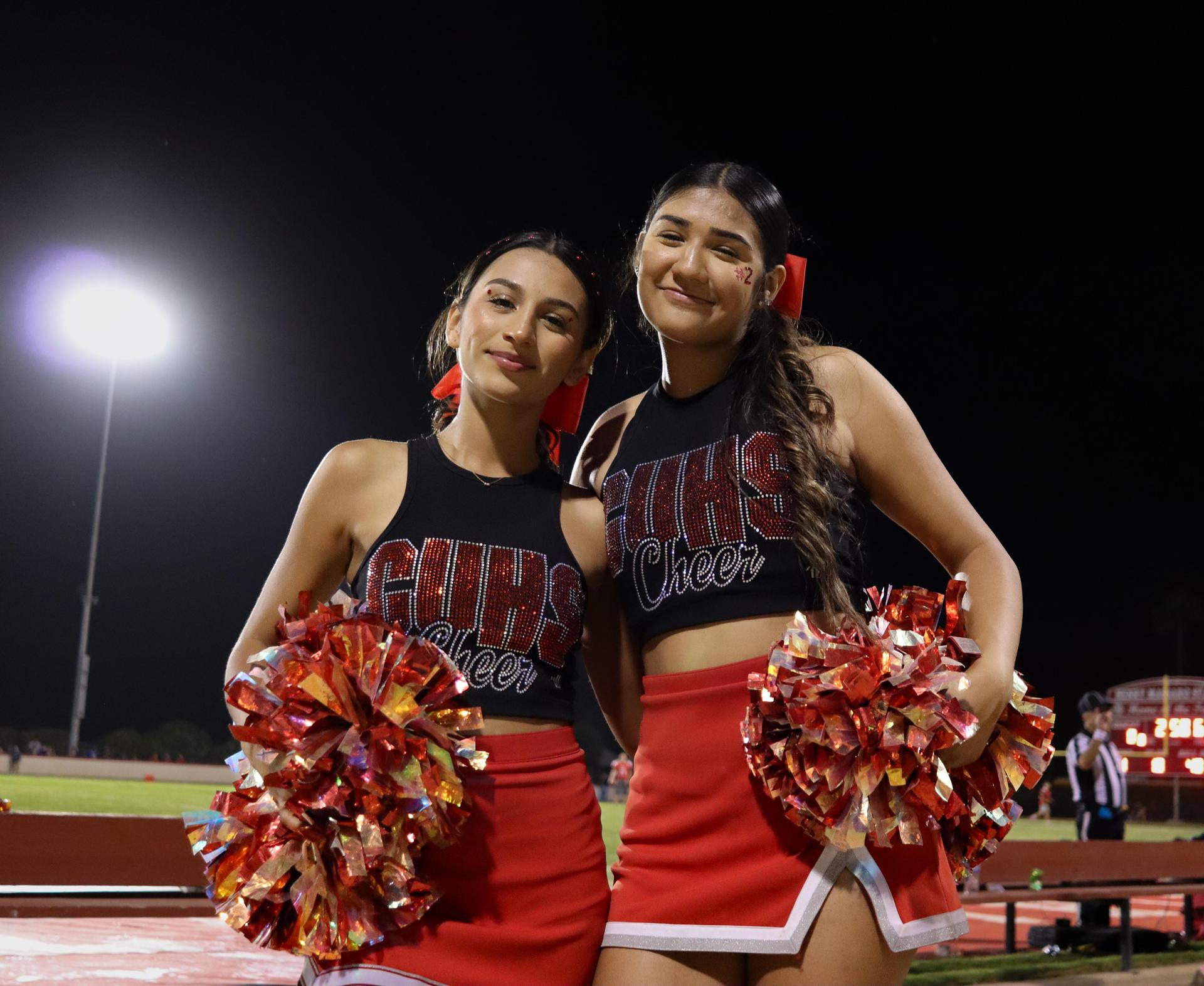 Varsity girls cheering at the Parlier football game