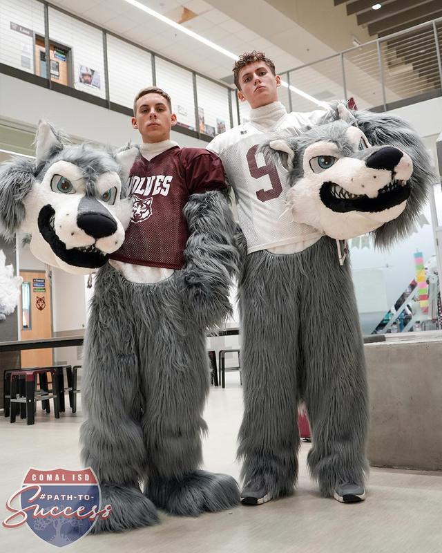 davenport mascots Drew Dimmitt and Jackson Kotowski posing in their suits