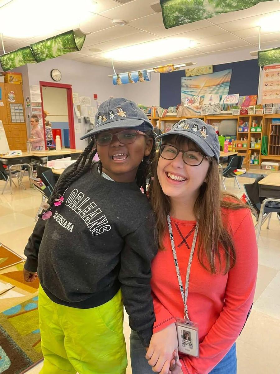 smiling teacher and student