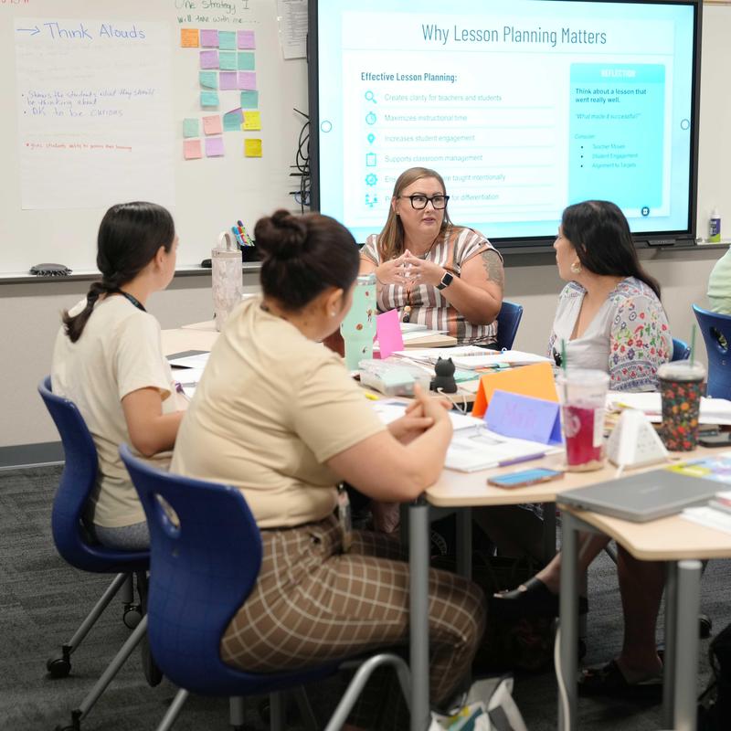 Table discussion during New Teacher Academy