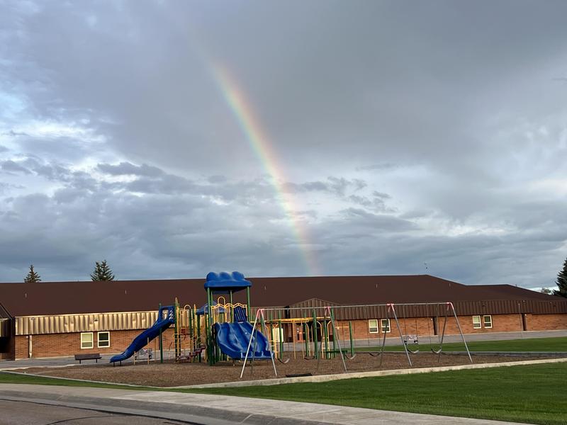 rainbow over playground equipment