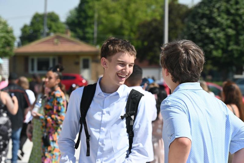 student wearing backpack outside