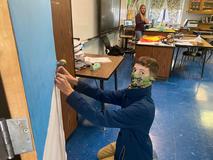 Students working on Christmas door decorations