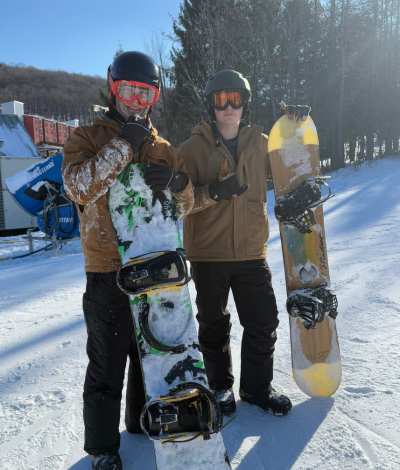 Two Students with Snowboards