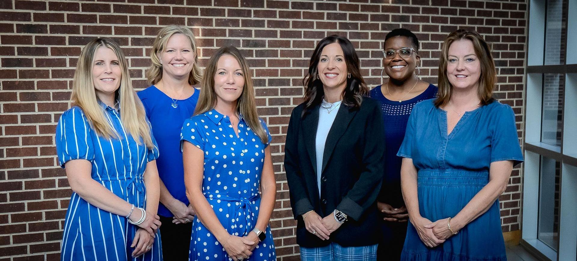 weatherford high school counselors standing in front of a brick wall
