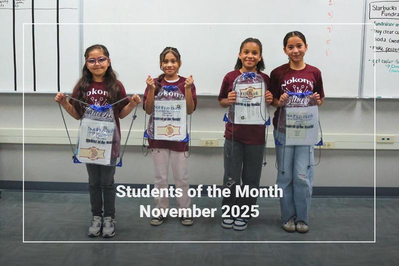 Students holding a bag
