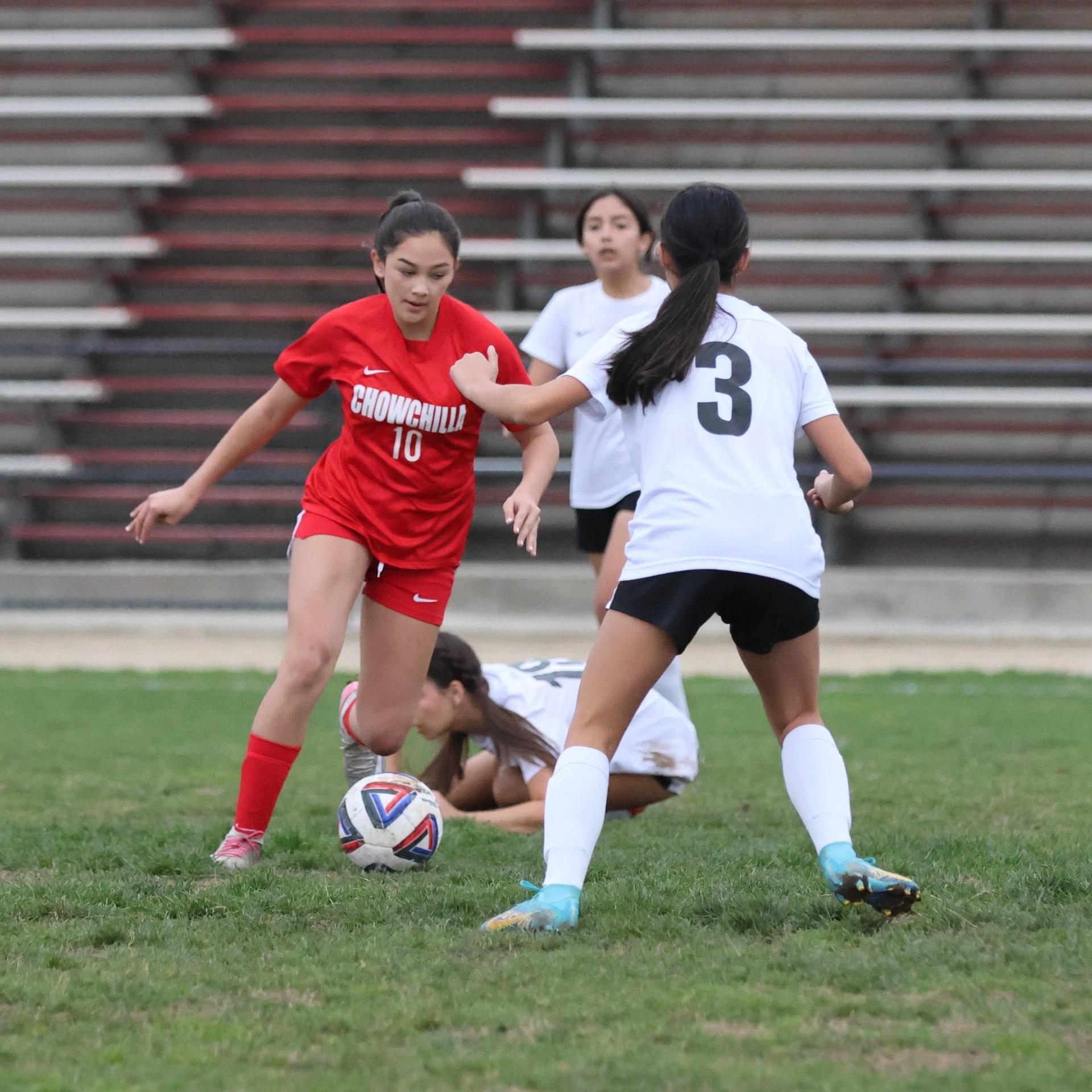 Junior Varisty girls playing soccer against liberty
