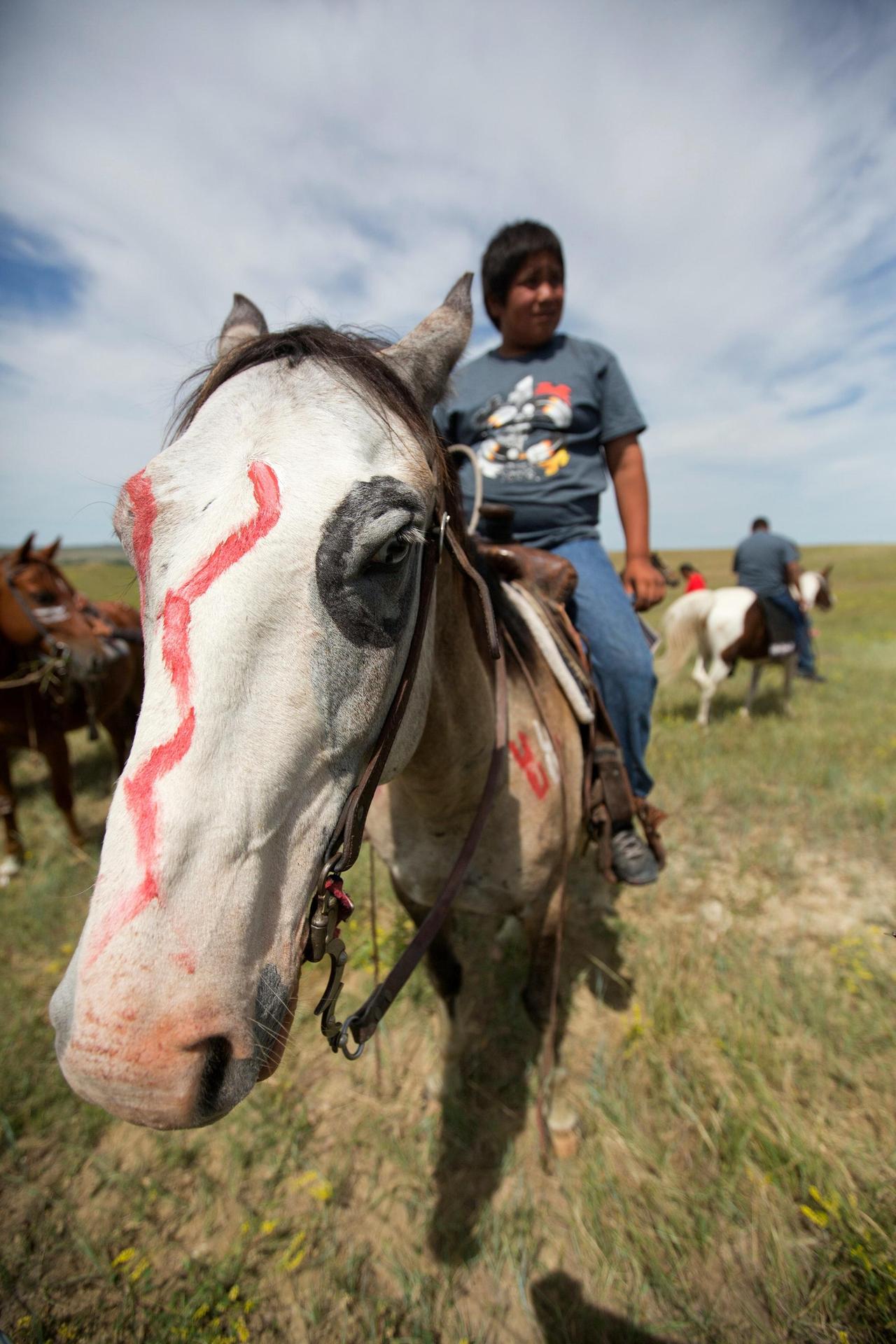 Native American boy on a horse