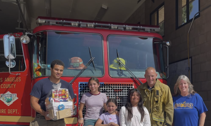 firefighters with students
