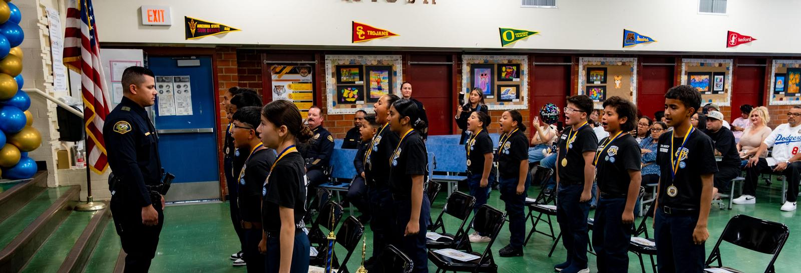 students at cops for kids graduation