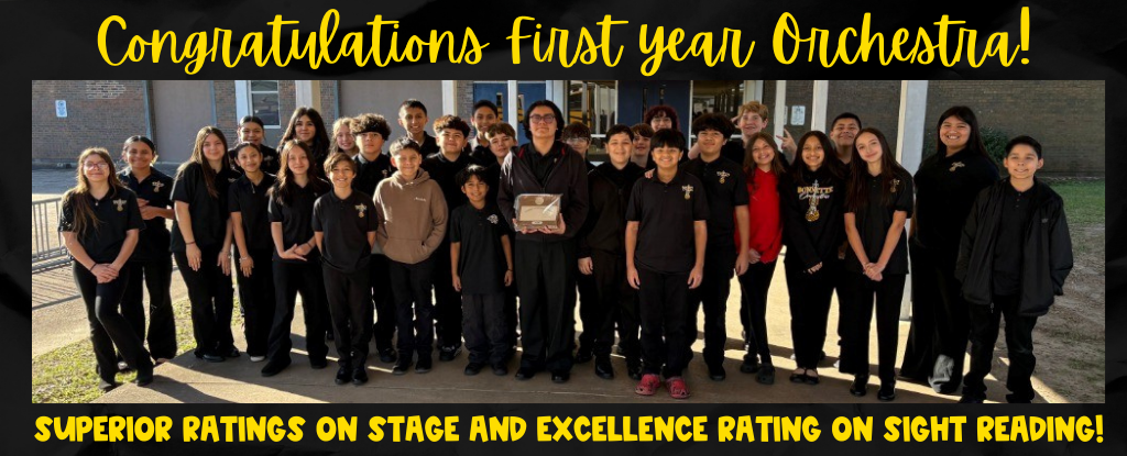 Group of students celebrating with a trophy and a banner for orchestra achievements.