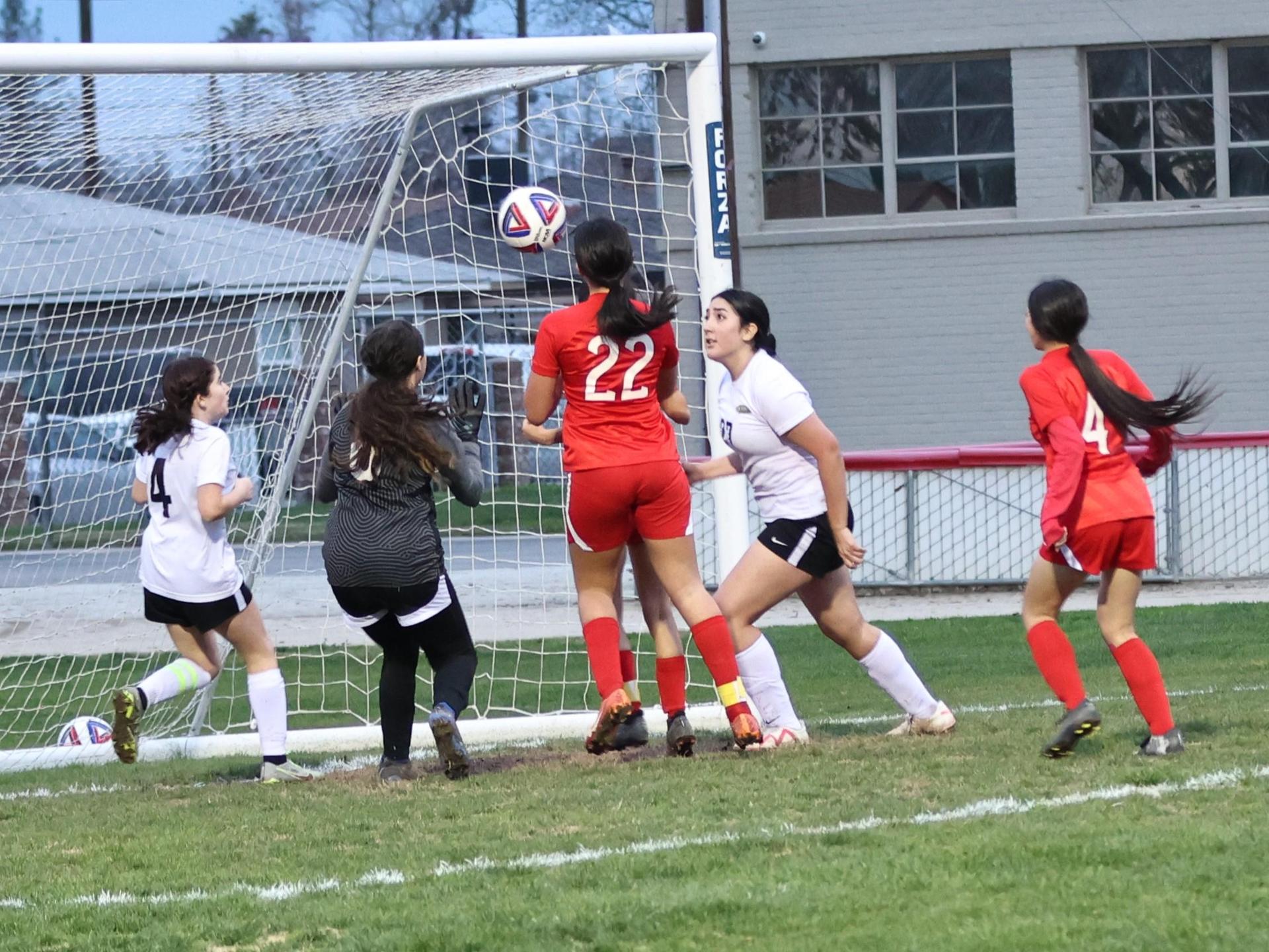 Junior varsity girls playing soccer against liberty