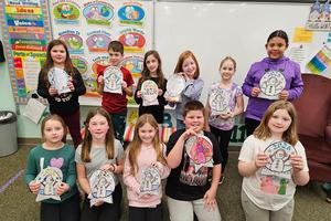 Displaying their snow globes are (Front) Avery Overfield, Hayden Judy, Bri Keibler, Alex Felentzer, Julianna Milanovich, (Back) Sammie Younger, Grant Spreyne, Adelina Kearns, Iris Florio, Joy Dixon, and Kariana Hall