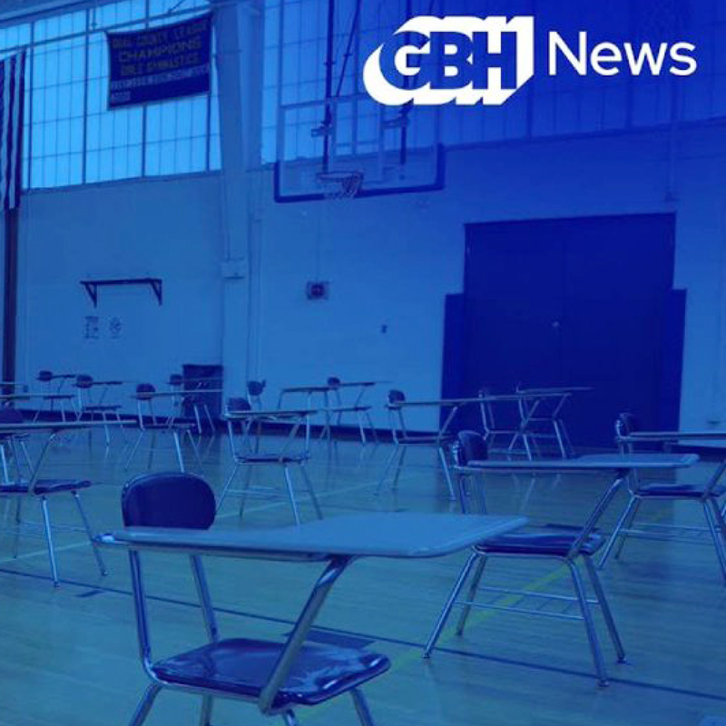 A classroom set against a blue screen effect