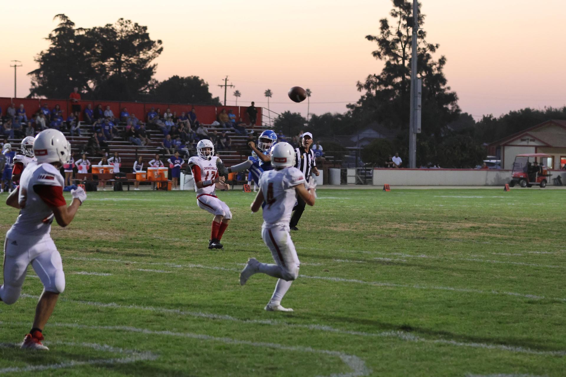 Junior Varsity football players in action against Caruthers