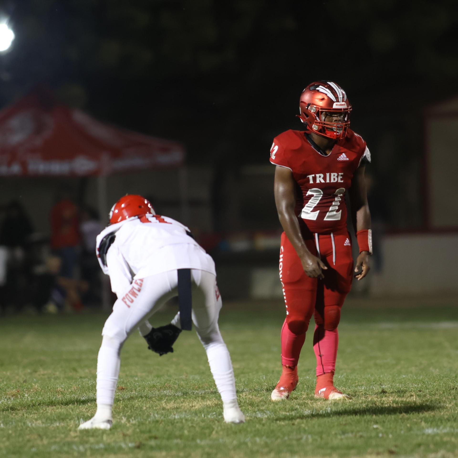 varsity boys playing football against Fowler