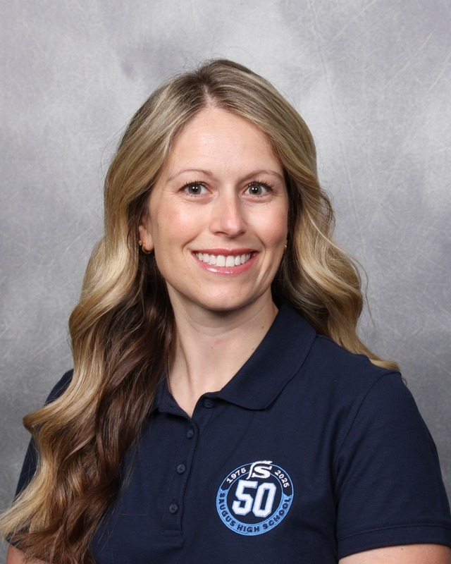 Amber Feldman, a blond woman in a Saugus High School shirt smiling