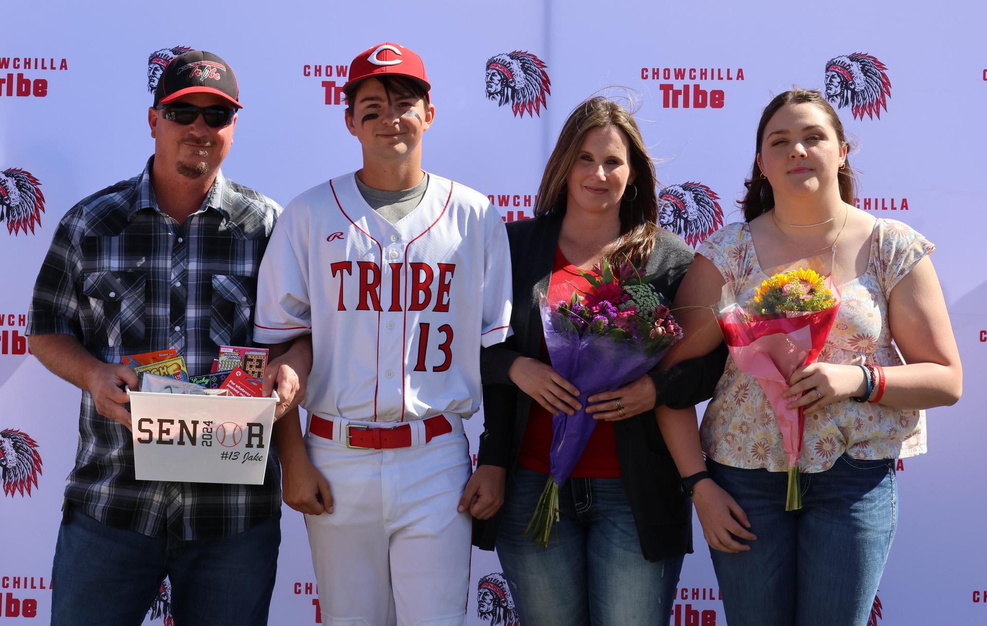Seniors Posing With Teammates, Coaches, And Family