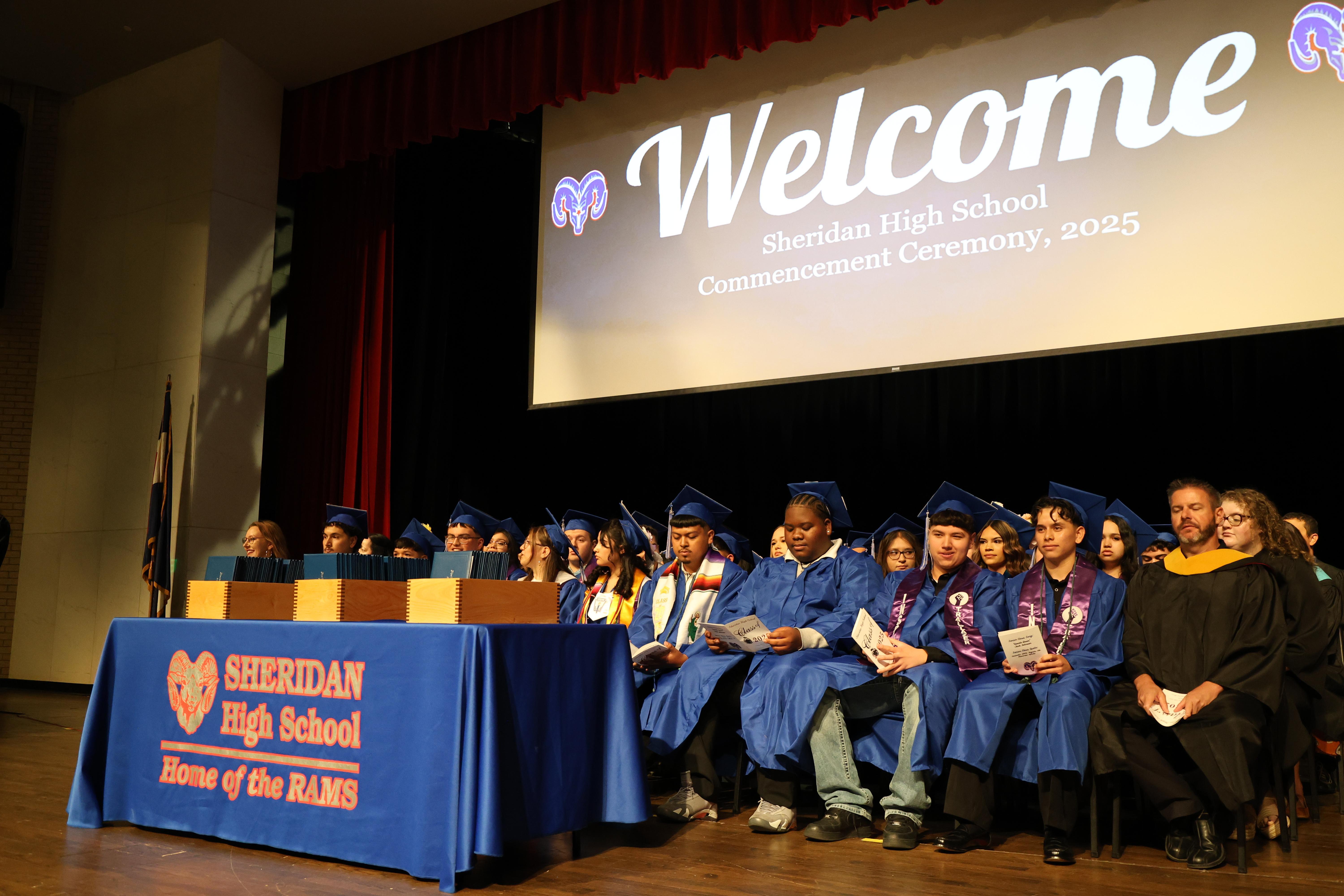 Students sitting at their high school graduation ceremony