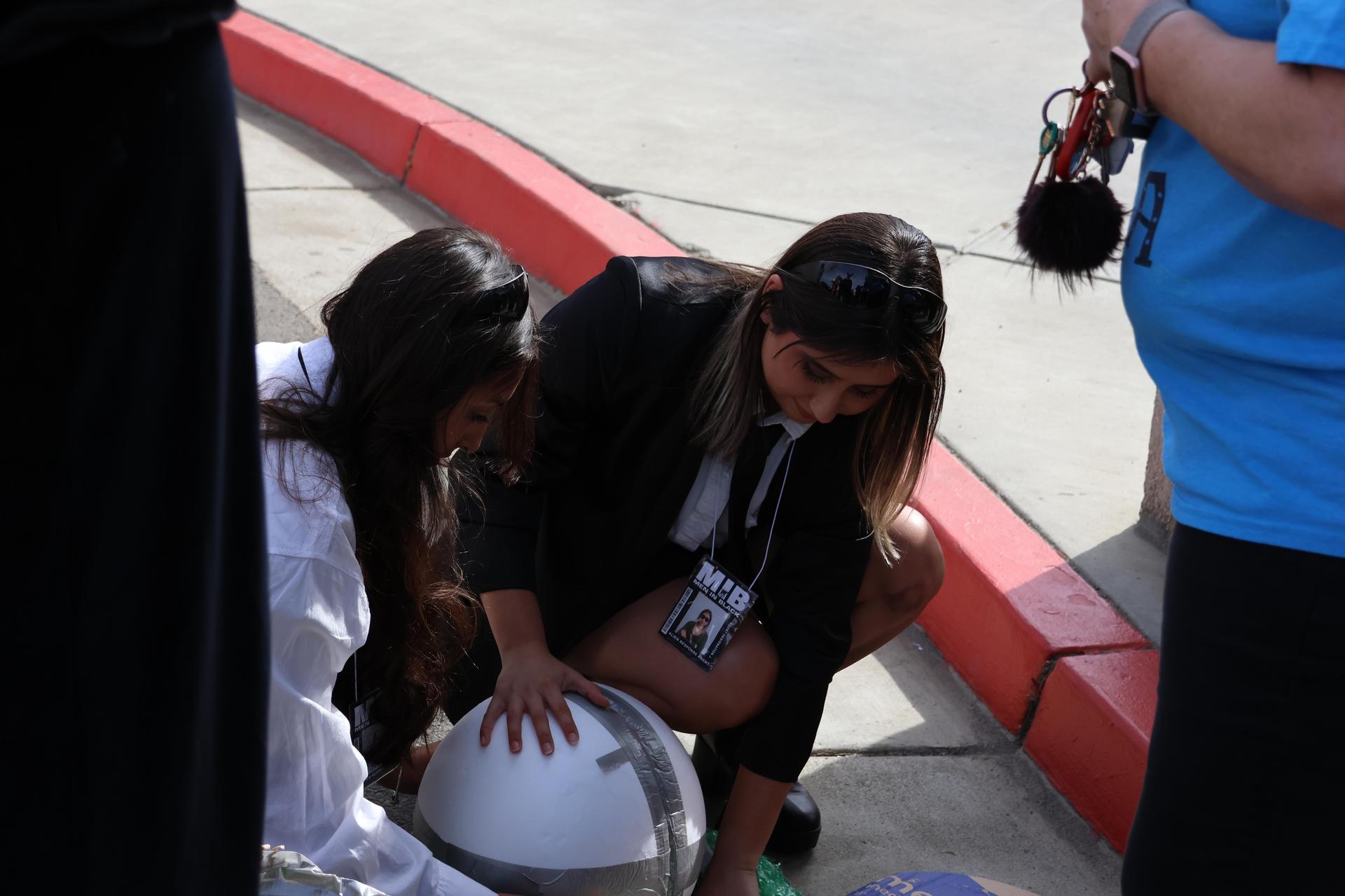 students and staff enjoying the pumpkin drop