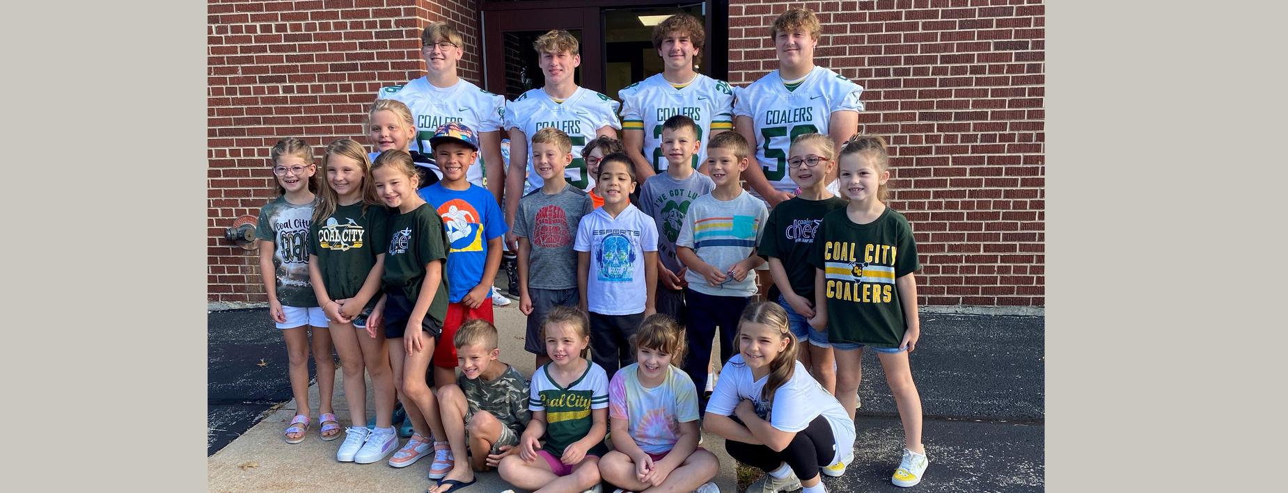 Football players visit the Elementary School