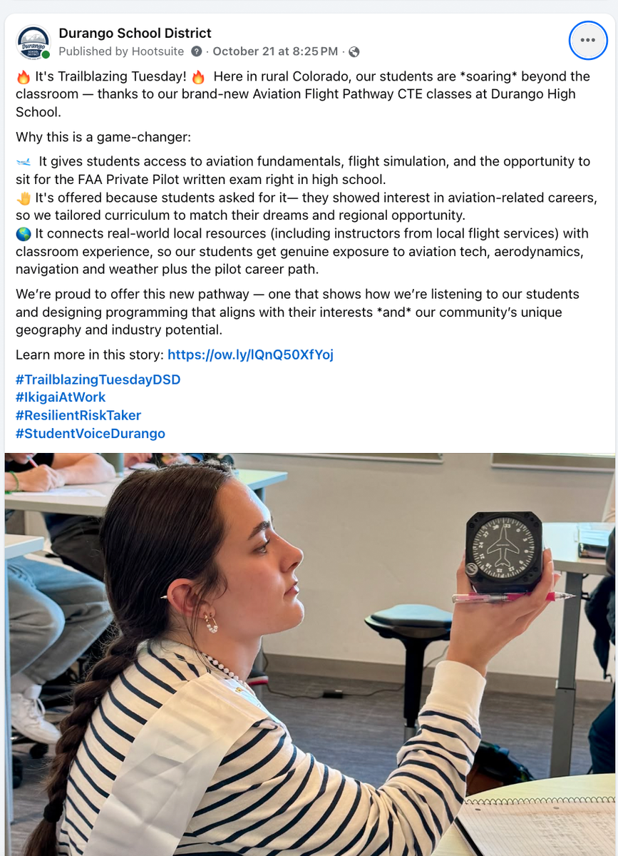 A facebook post shows a girl looking at a flight tech thing in a classroom