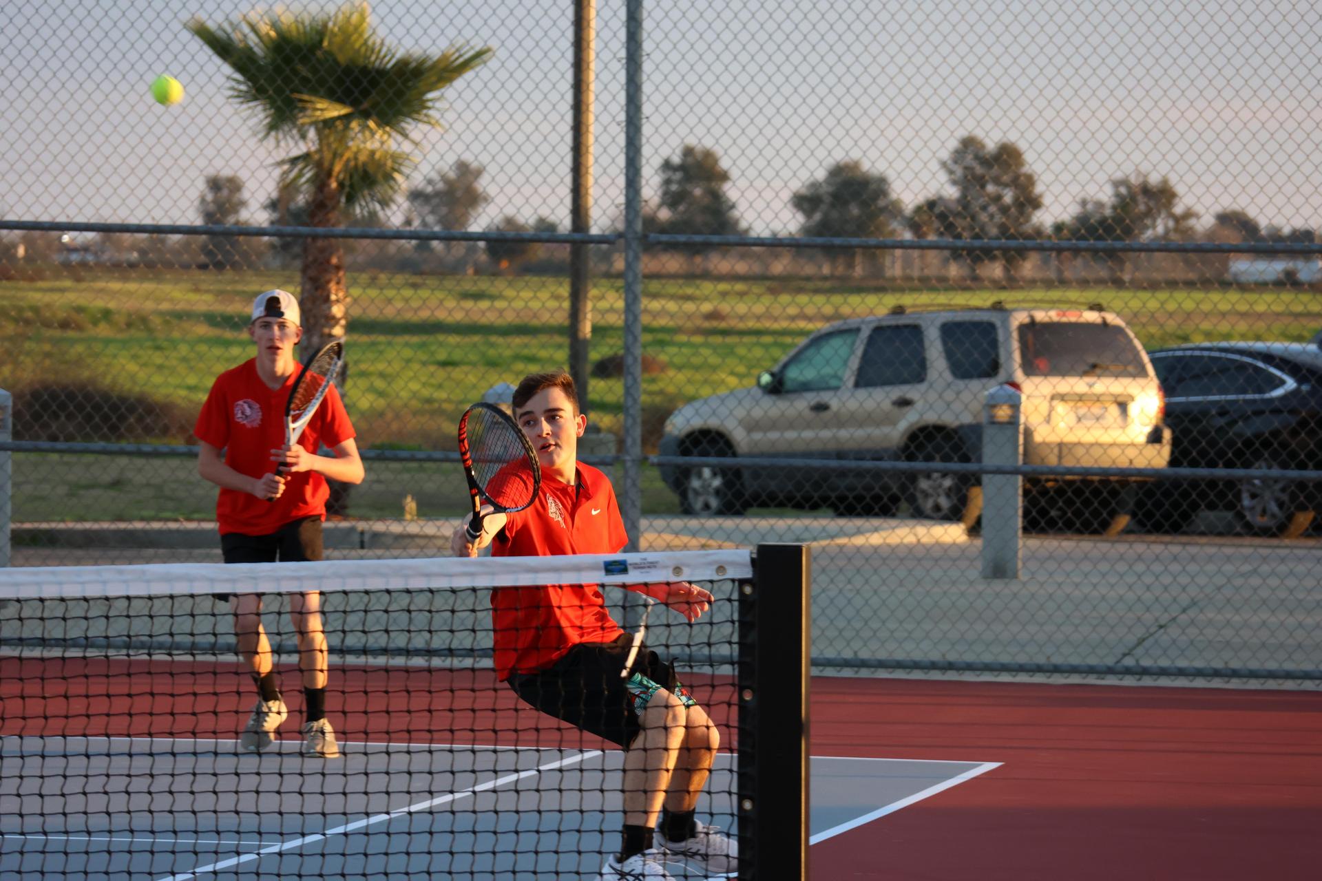 CUHS Boys playing tennis against coalinga