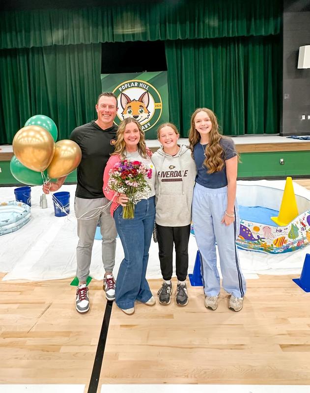 Photo of teacher of the year with family.