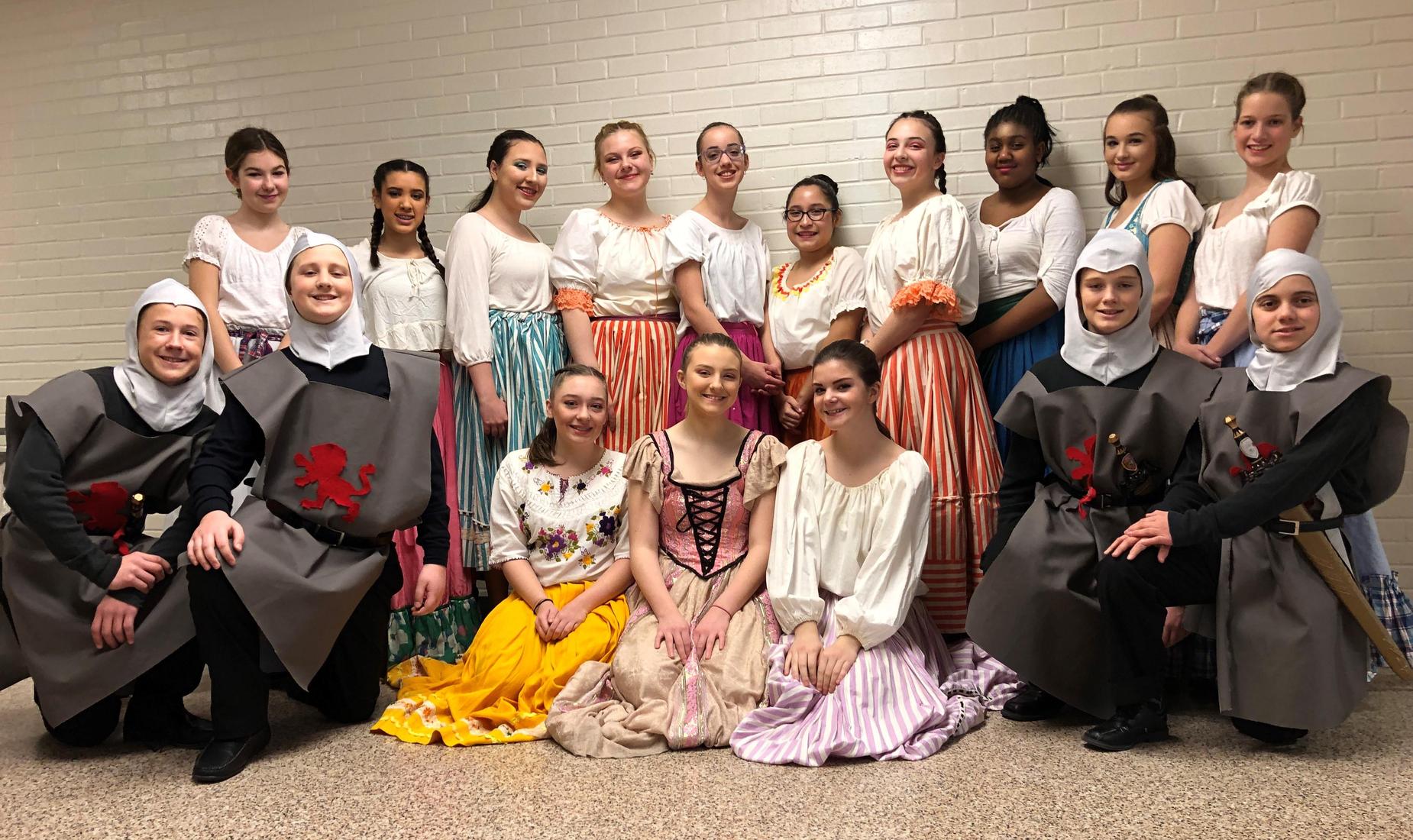 Middle School students, girls and boys, dressed up in costumes ready to perform in high school musical Cinderella.