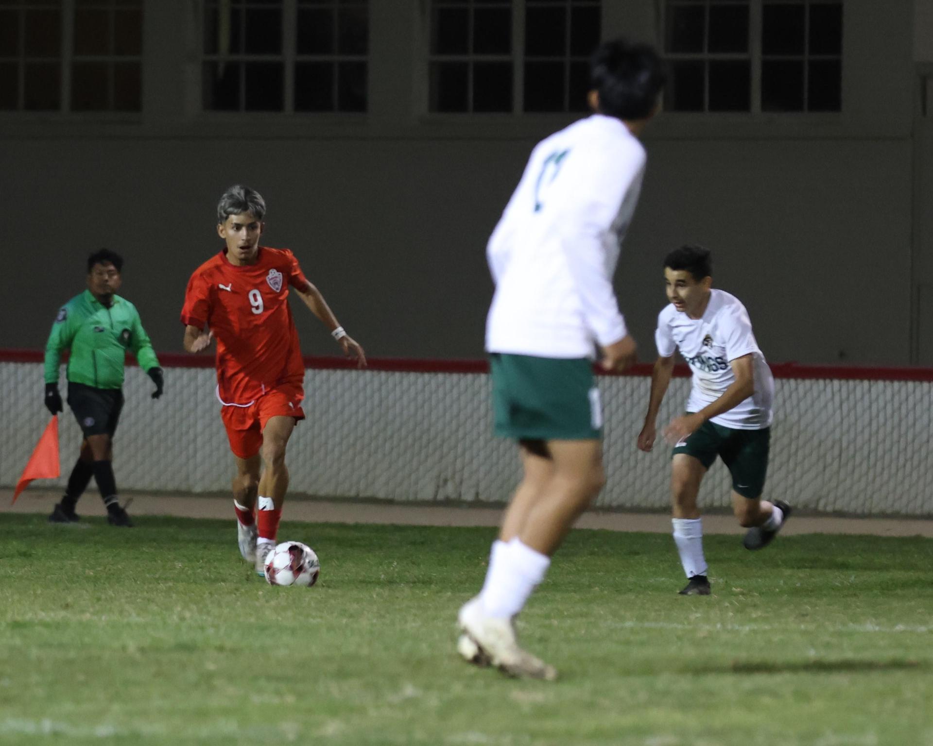 Varsity boys play soccer against Kingsburg