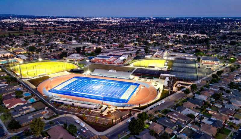 Aerial view of El Rancho High School stadium prepared for upcoming graduation ceremony