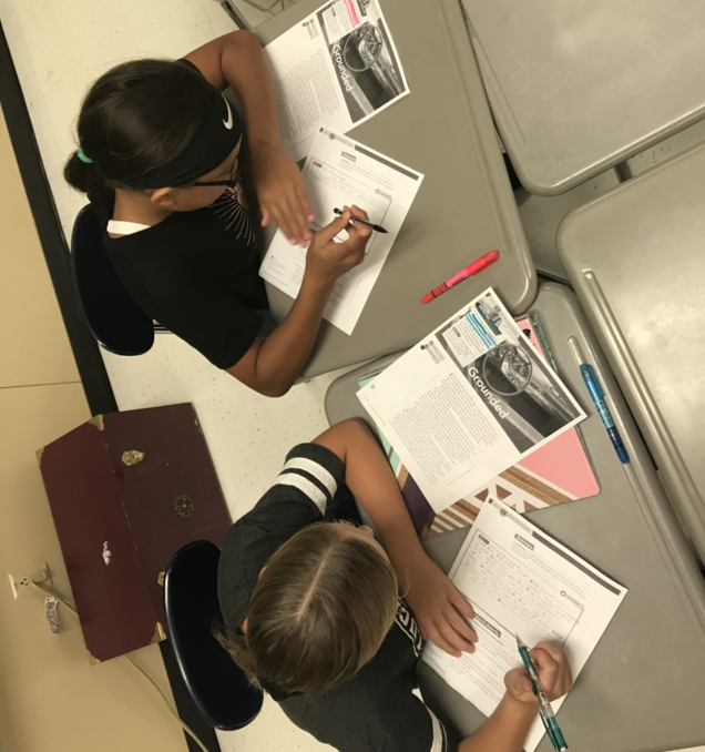 SFJH English Students complete an assignment.