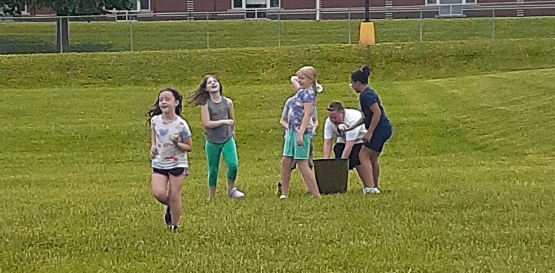 kids having a water balloon fight