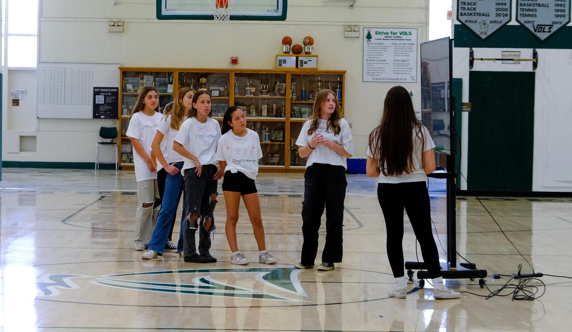 Chester High's  Peer Group talks about mental health awareness during a presentation in the gym.