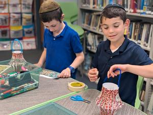 Boys making chinese lanterns