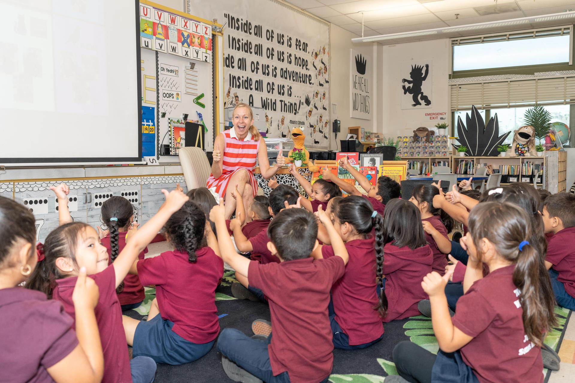 Kindergarten teacher and students.