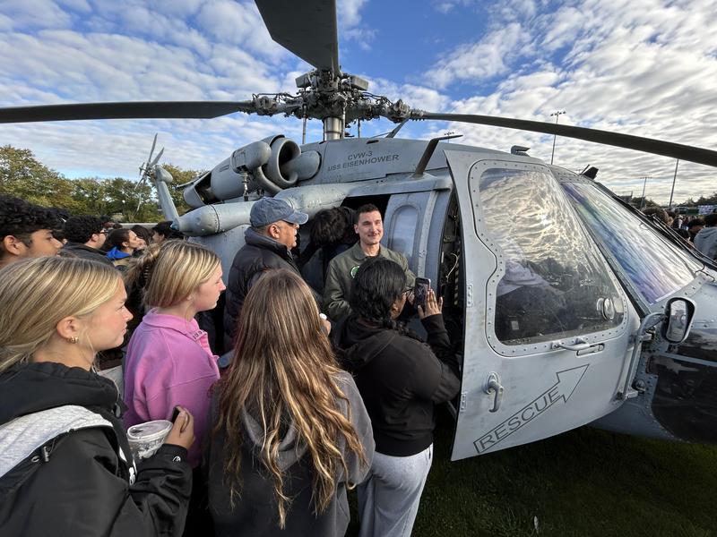 Image of students listening to chopper pilot