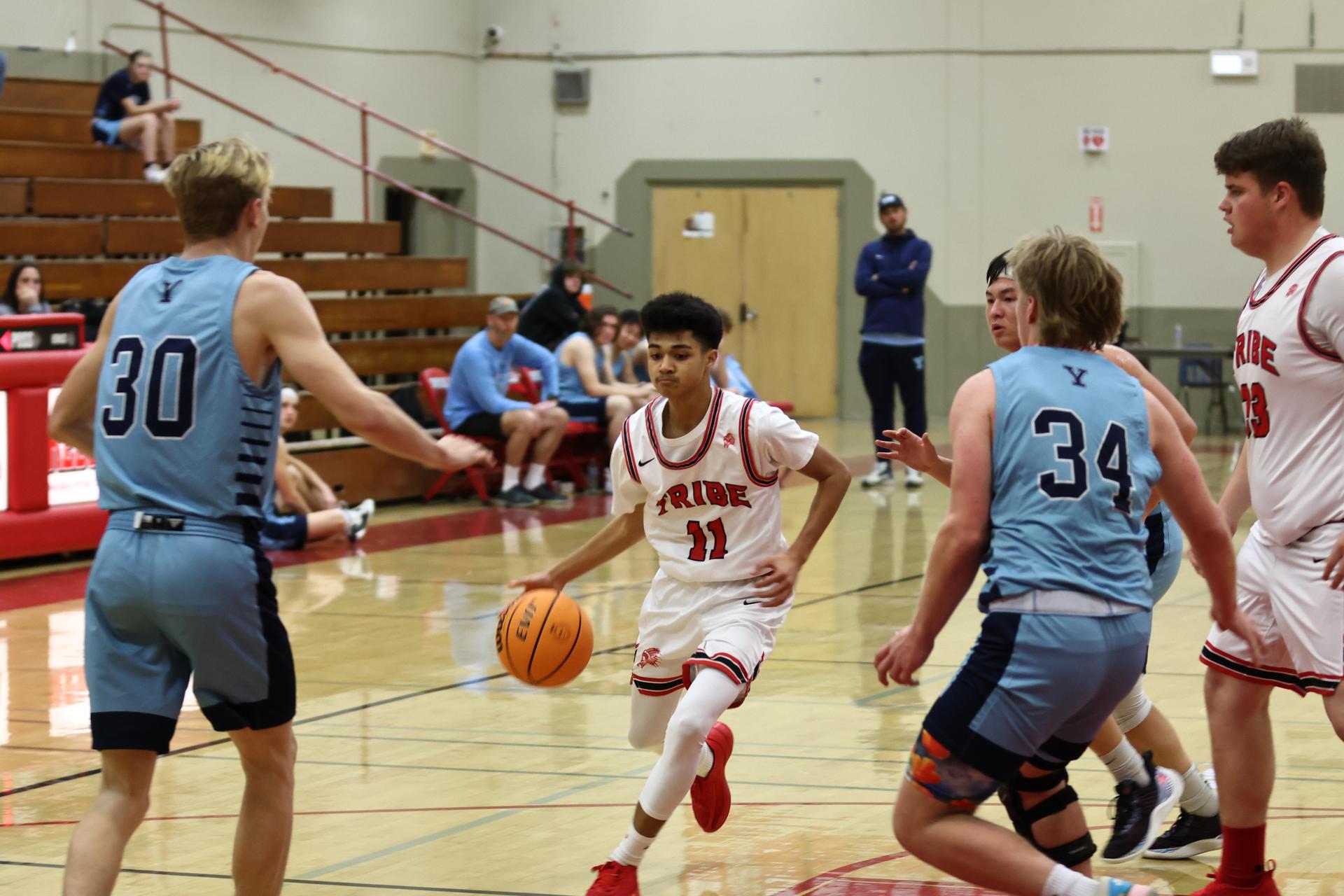 Varsity boys playing basketball against yosemite