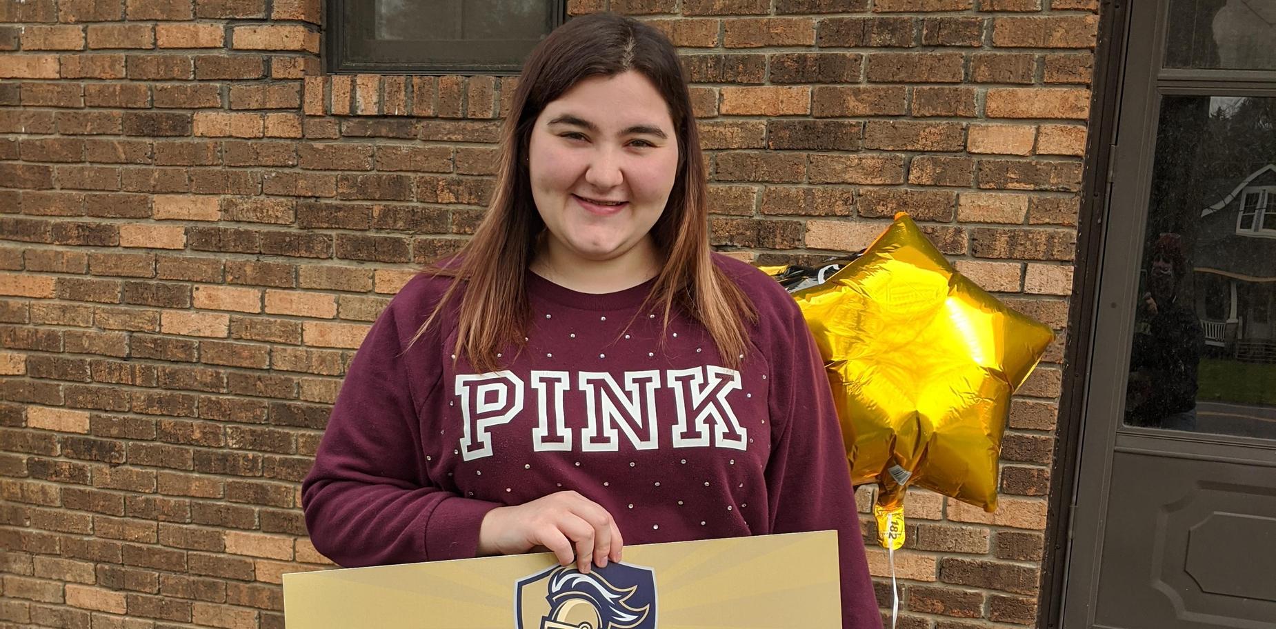 Senior receiving cap and gown