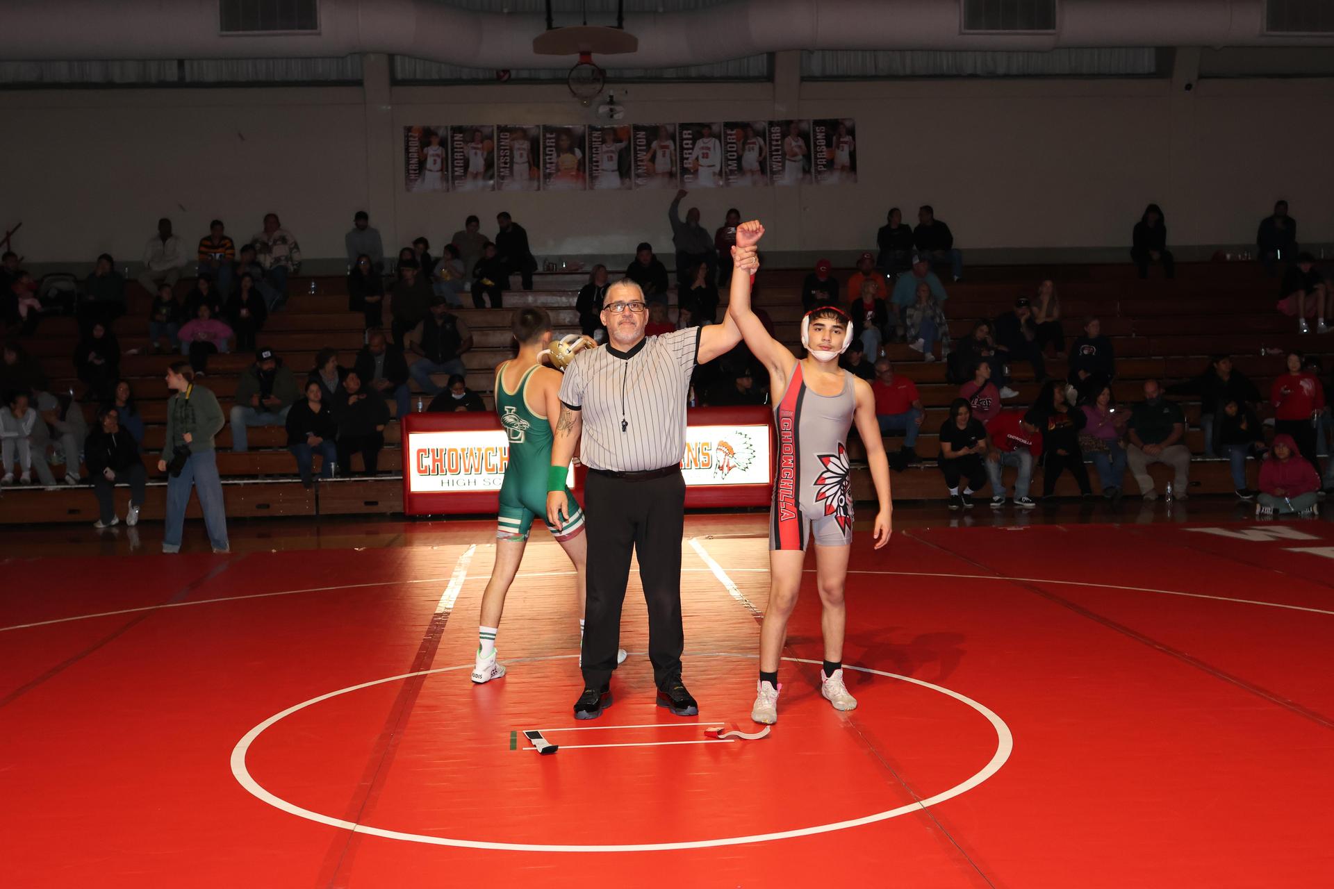 Wrestling winners with hands up 117