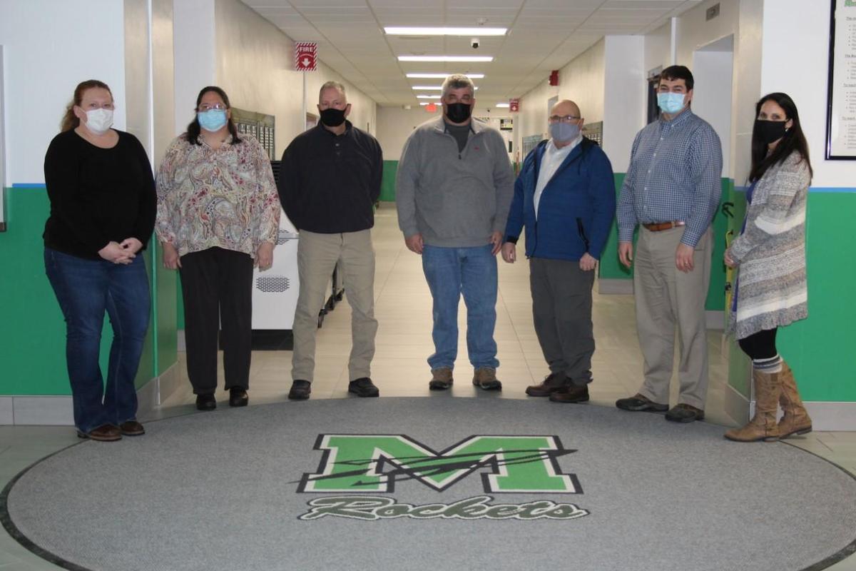 photo ofBOE members in school lobby